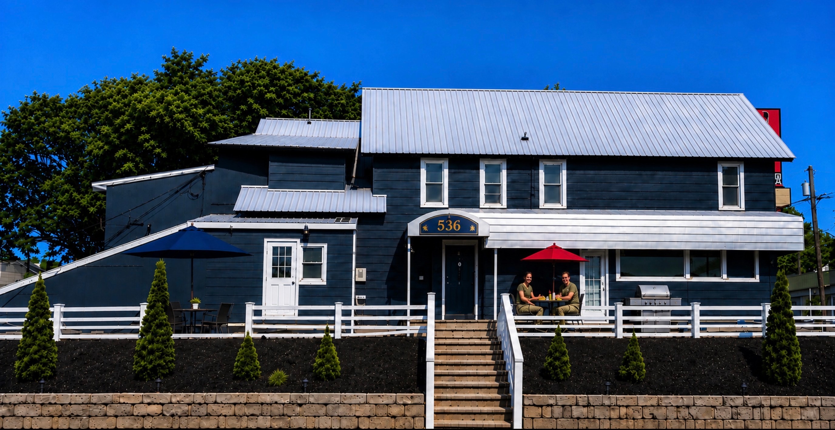 The Arsenal Rentals building with outdoor resident seating