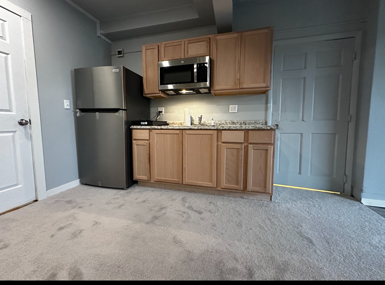Modern apartment kitchen with granite countertops
